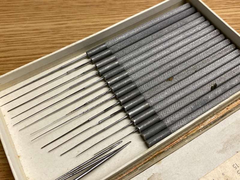 Watchmakers/jewelers cutting & smoothing broaches