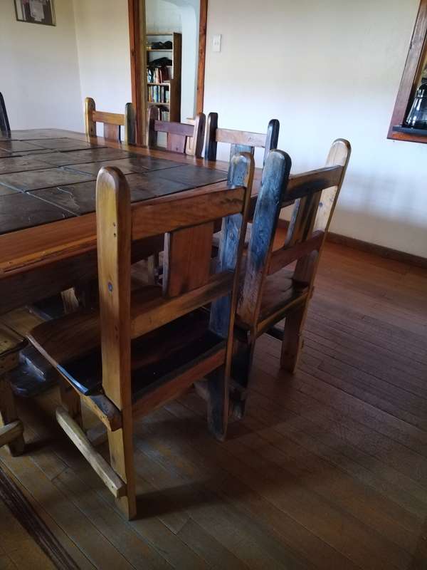 10 seater sleeper wood (Rhodesian teak) and slate dining room table & chairs in good condition