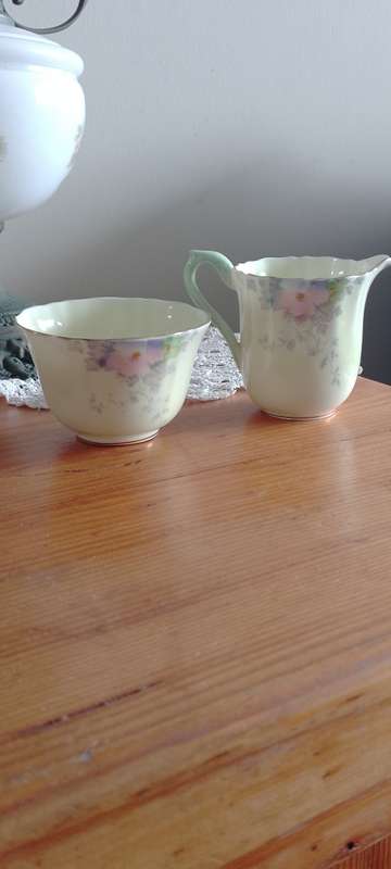 *#A VINTAGE CROWN STAFFORDSHIRE SUGAR AND CREAM SET.