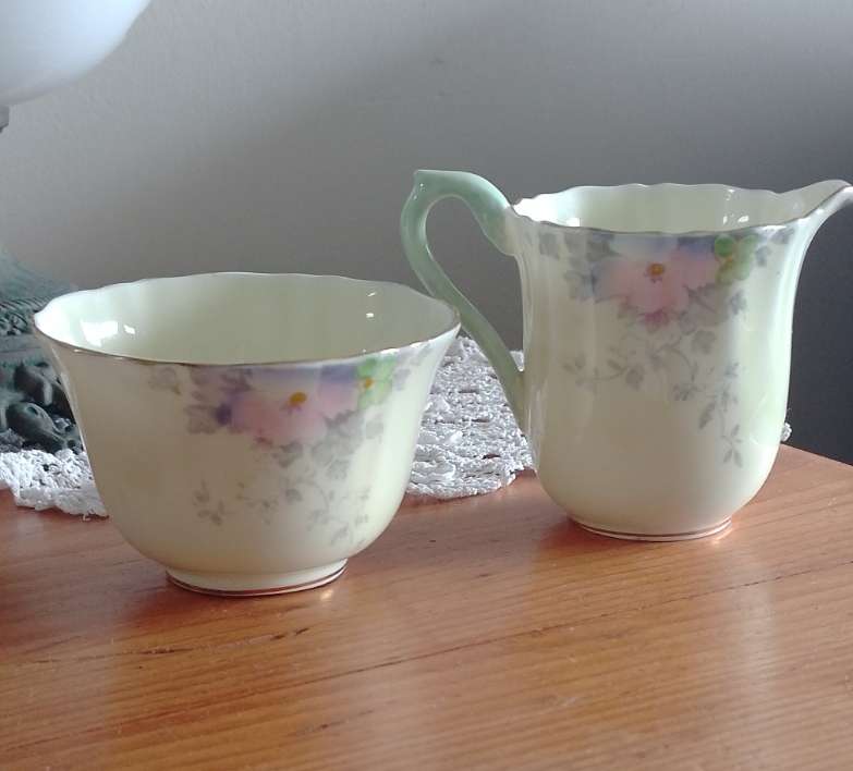 *#A VINTAGE CROWN STAFFORDSHIRE SUGAR AND CREAM SET.