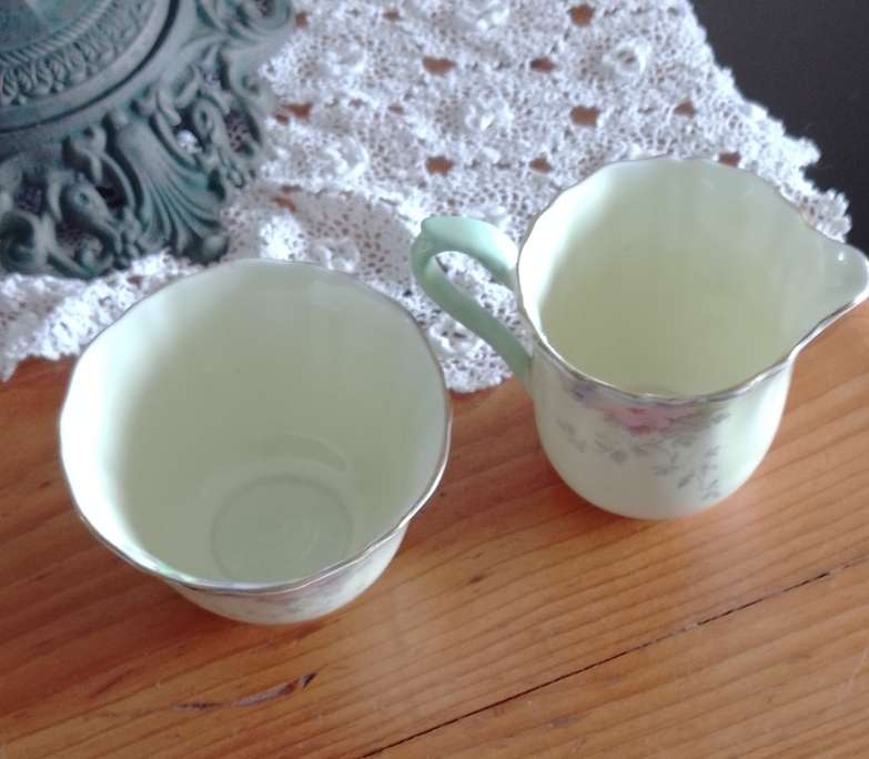 *#A VINTAGE CROWN STAFFORDSHIRE SUGAR AND CREAM SET.