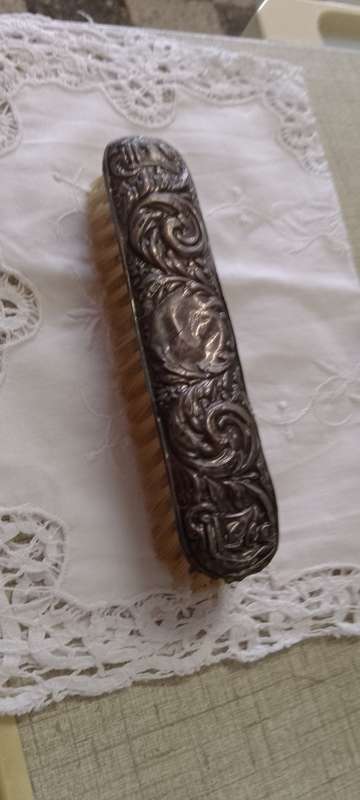Antique silver handled clothes brush  16cm long