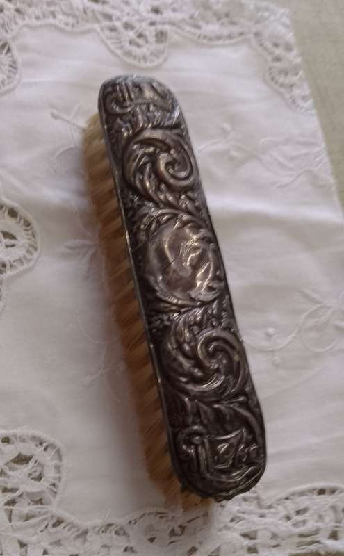 Antique silver handled clothes brush  16cm long
