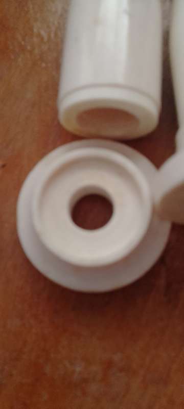 A pair of bone salt and pepper shakers