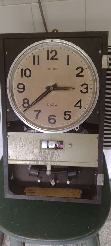 A vintage Seiko wall chiming clock. For parts only. Not working front cover missing.