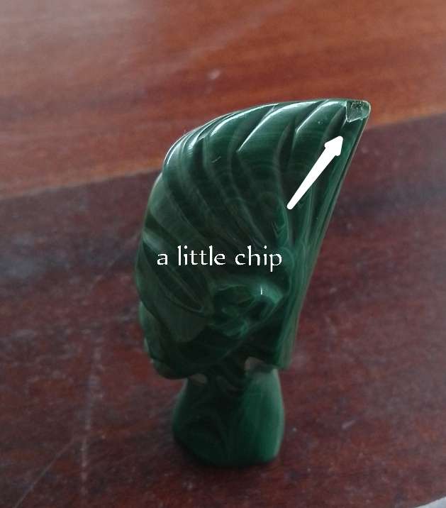 A Malachite "talking head" 7cm tall base 1.5cm across
