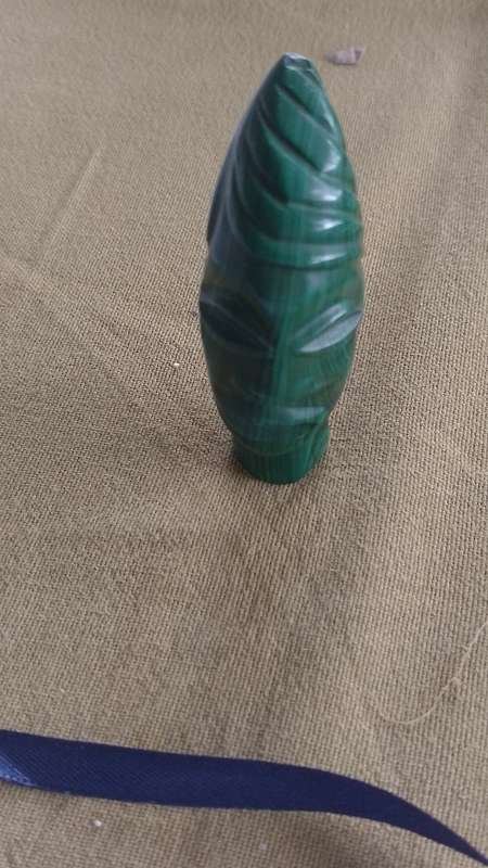 A Malachite "talking head" 7cm tall base 1.5cm across