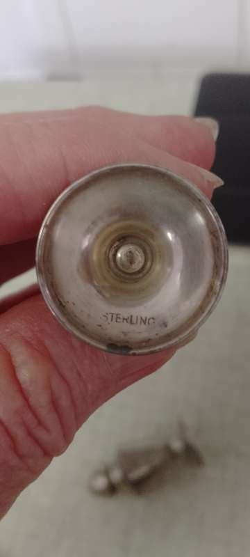 A pair of Sterling salt and pepper shakers 5cm tall base 2.5cm