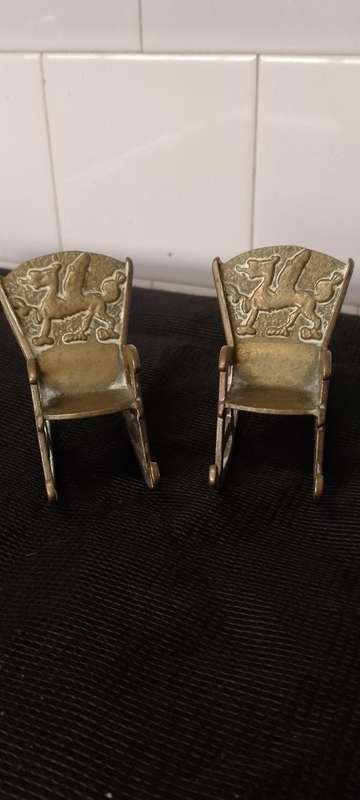 A Pair of antique Brass Chinese Dragon motive miniature rocking chairs.