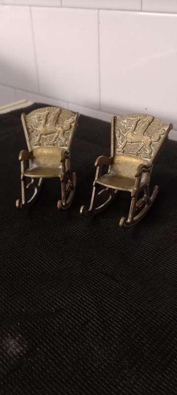 A Pair of antique Brass Chinese Dragon motive miniature rocking chairs.
