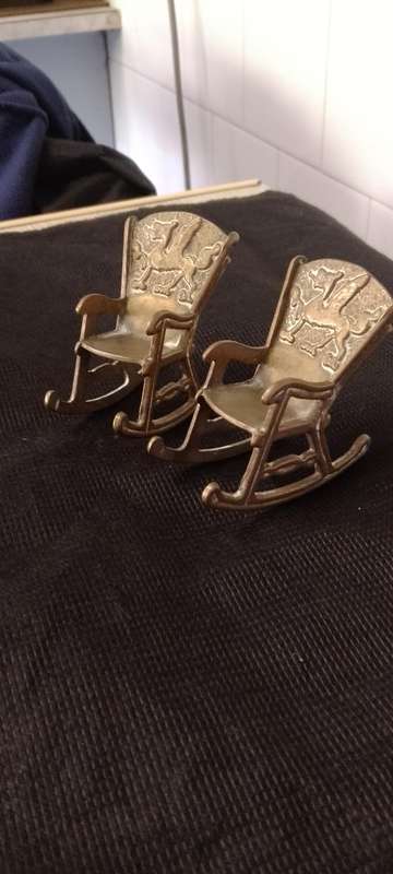 A Pair of antique Brass Chinese Dragon motive miniature rocking chairs.