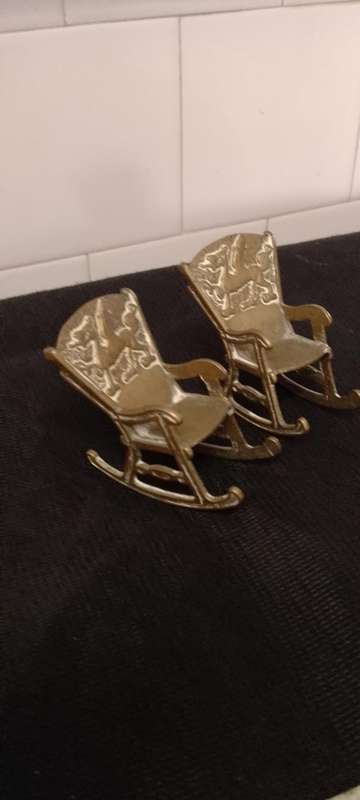 A Pair of antique Brass Chinese Dragon motive miniature rocking chairs.