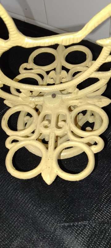 A heavy cast iron -chicken egg holder
