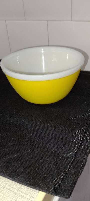 A Vintage yellow JAJ no.702 milk glass mixing bowl.
