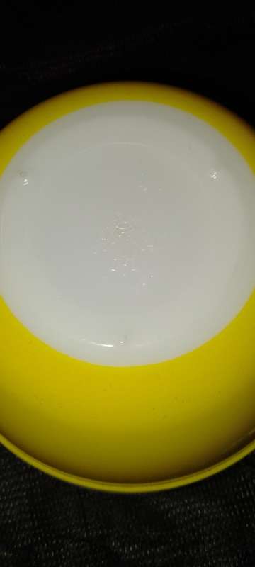 A Vintage yellow JAJ no.702 milk glass mixing bowl.