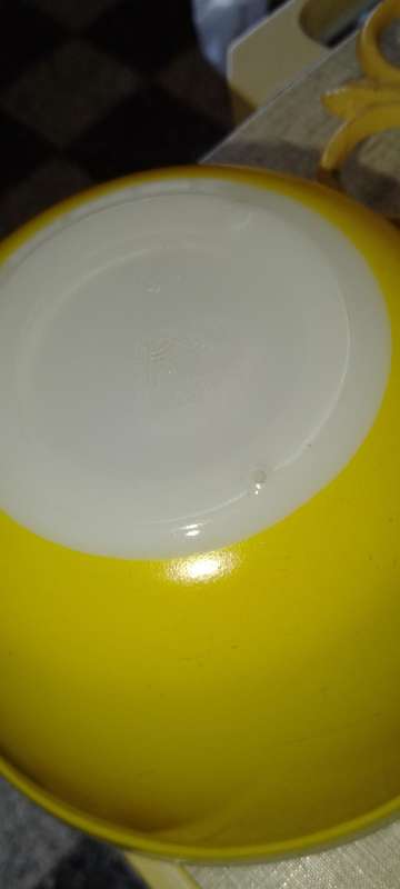 A Vintage yellow JAJ no.702 milk glass mixing bowl.