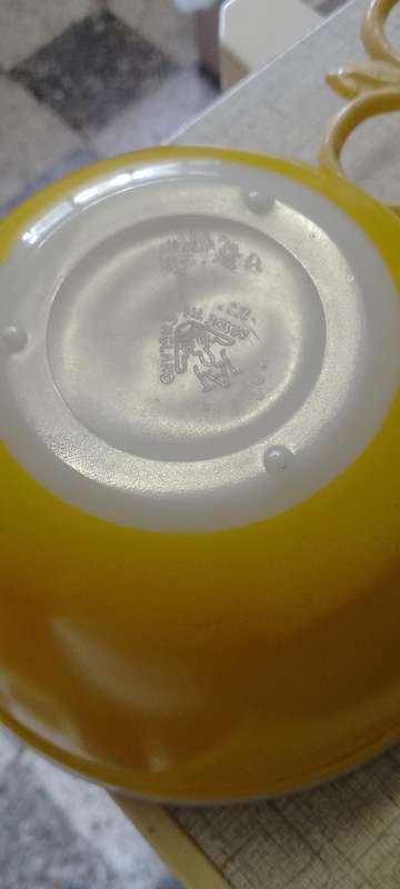 A Vintage yellow JAJ no.702 milk glass mixing bowl.