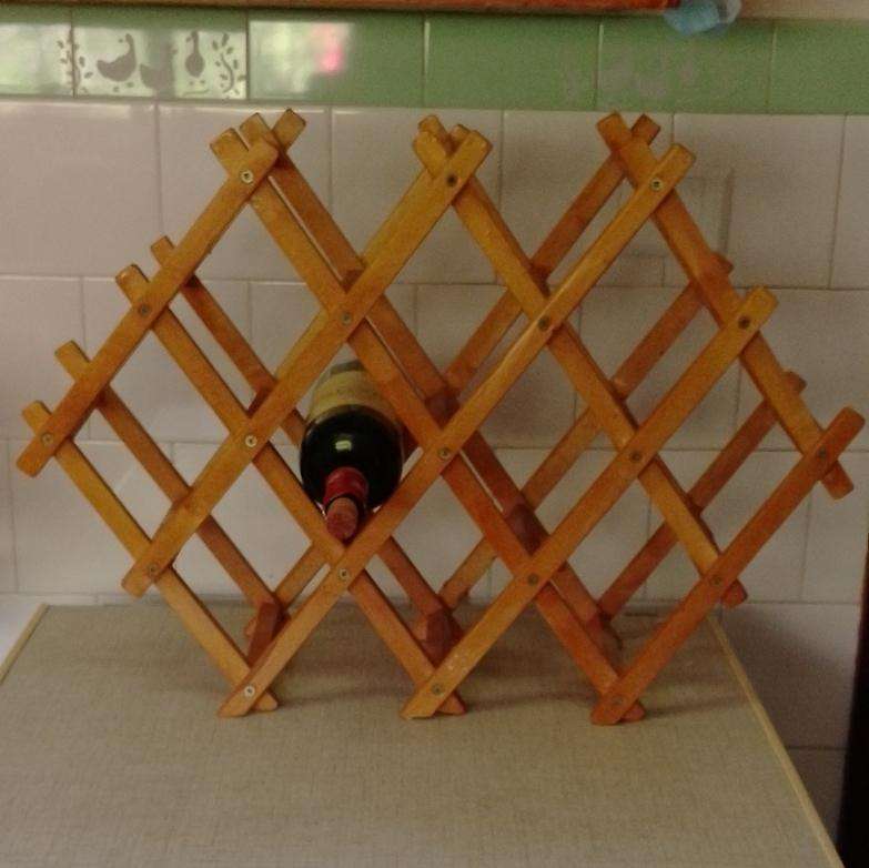 A wooden wine rack (bottle not included)