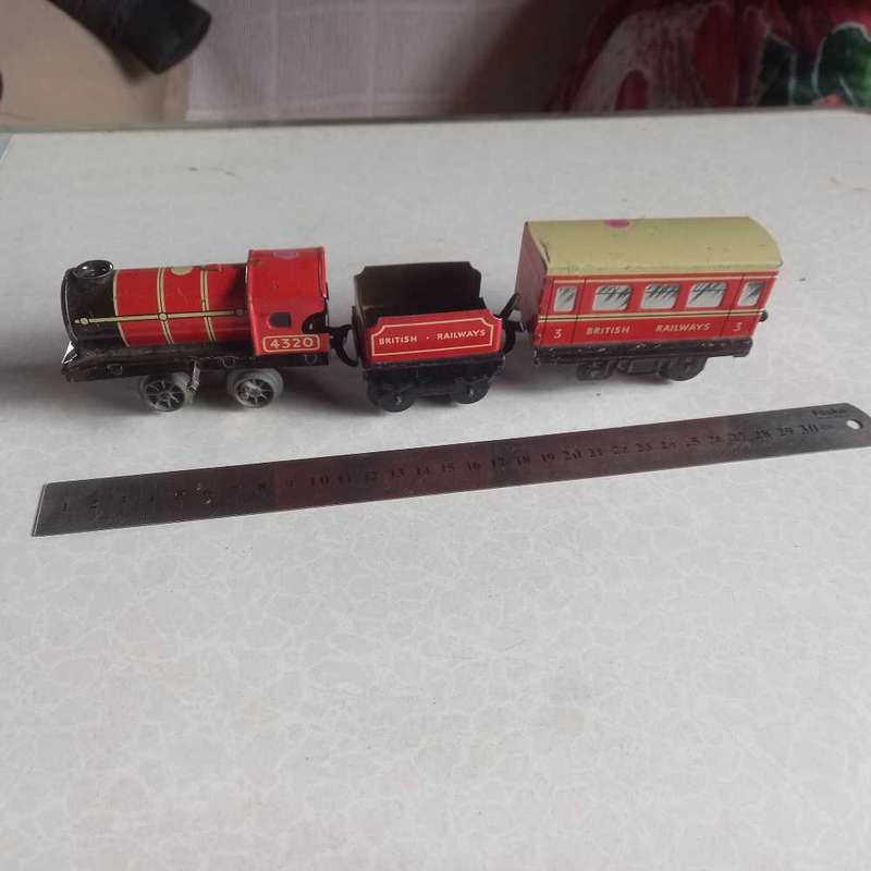 Vintage tin plate clockwork train. Please see