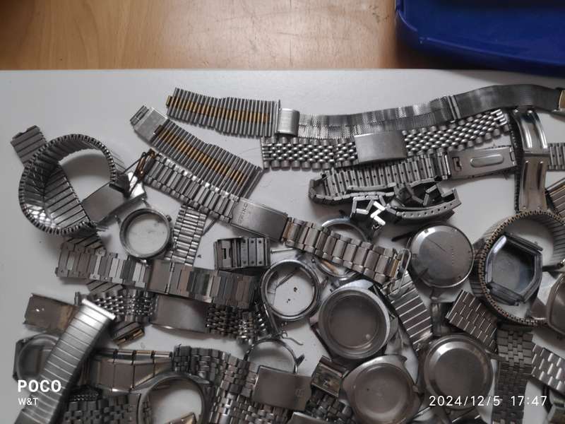 A lot of Stainless Steel Cases , casebacks and bracelets