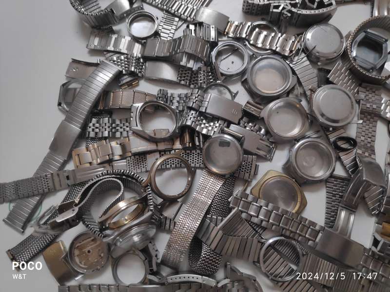 A lot of Stainless Steel Cases , casebacks and bracelets