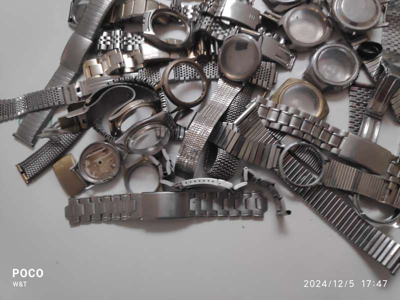 A lot of Stainless Steel Cases , casebacks and bracelets