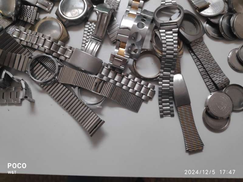 A lot of Stainless Steel Cases , casebacks and bracelets