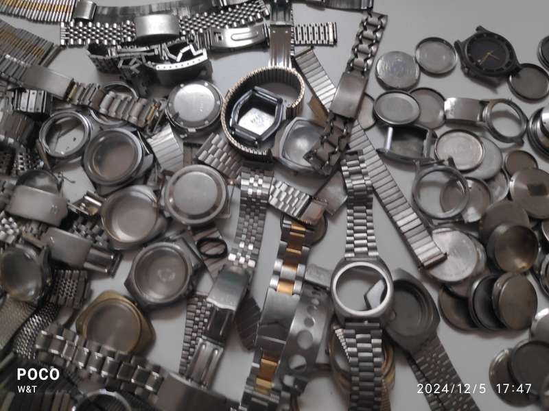 A lot of Stainless Steel Cases , casebacks and bracelets