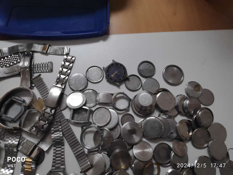 A lot of Stainless Steel Cases , casebacks and bracelets