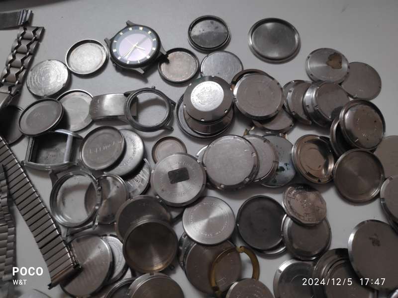 A lot of Stainless Steel Cases , casebacks and bracelets