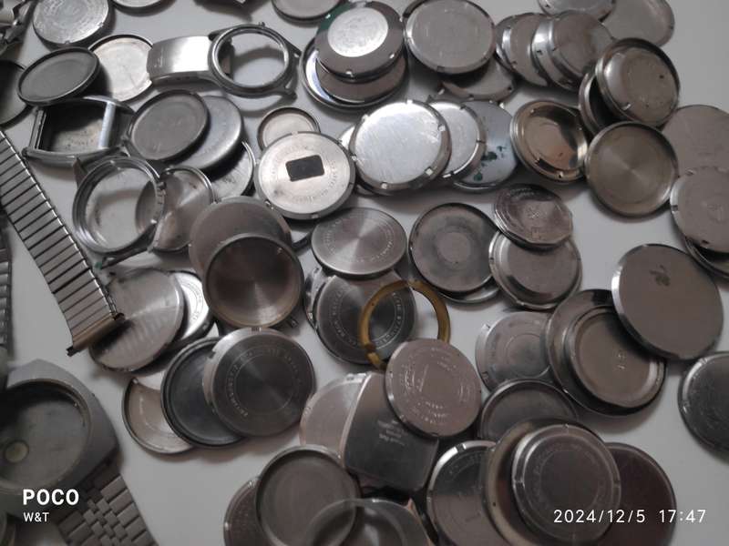 A lot of Stainless Steel Cases , casebacks and bracelets