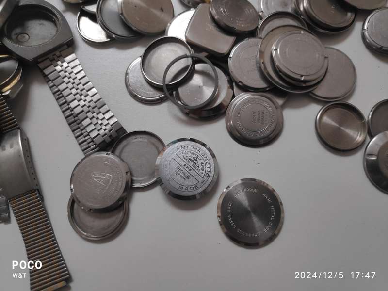 A lot of Stainless Steel Cases , casebacks and bracelets