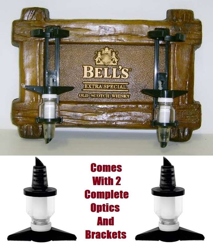 Liquor Dispensers: Bell`s Scotch Whisky with 2 Sets of Optics. Brand New. Collections Are Allowed.