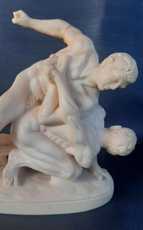VINTAGE IVORINE WRESTLING SCULPTURE  A TRIBUTE TO STRENGTH AND STRUGGLE