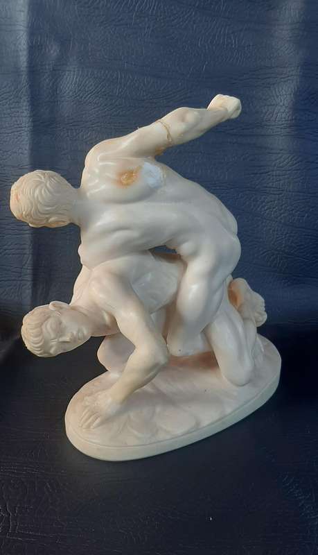 VINTAGE IVORINE WRESTLING SCULPTURE  A TRIBUTE TO STRENGTH AND STRUGGLE