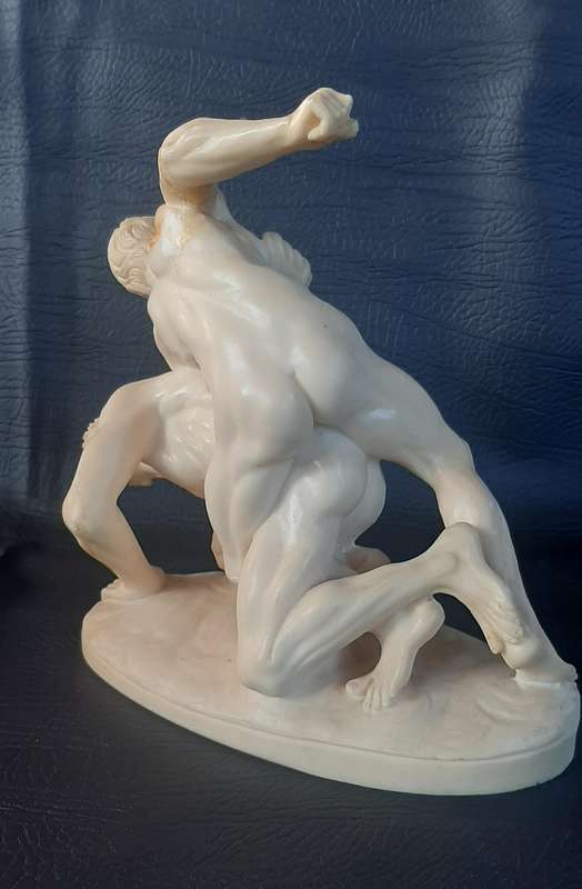 VINTAGE IVORINE WRESTLING SCULPTURE  A TRIBUTE TO STRENGTH AND STRUGGLE