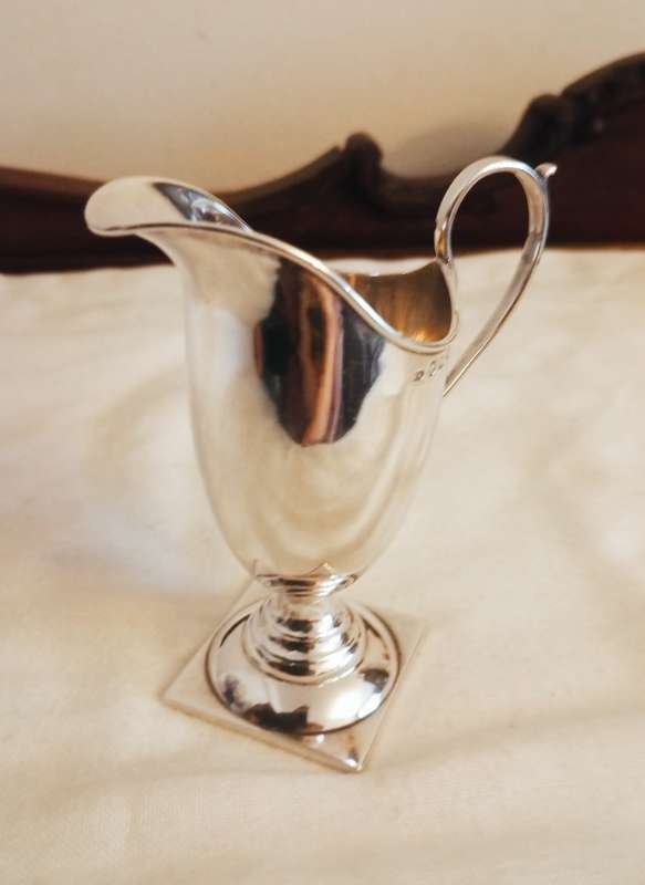 A lovely silver helmet jug in Georgian style