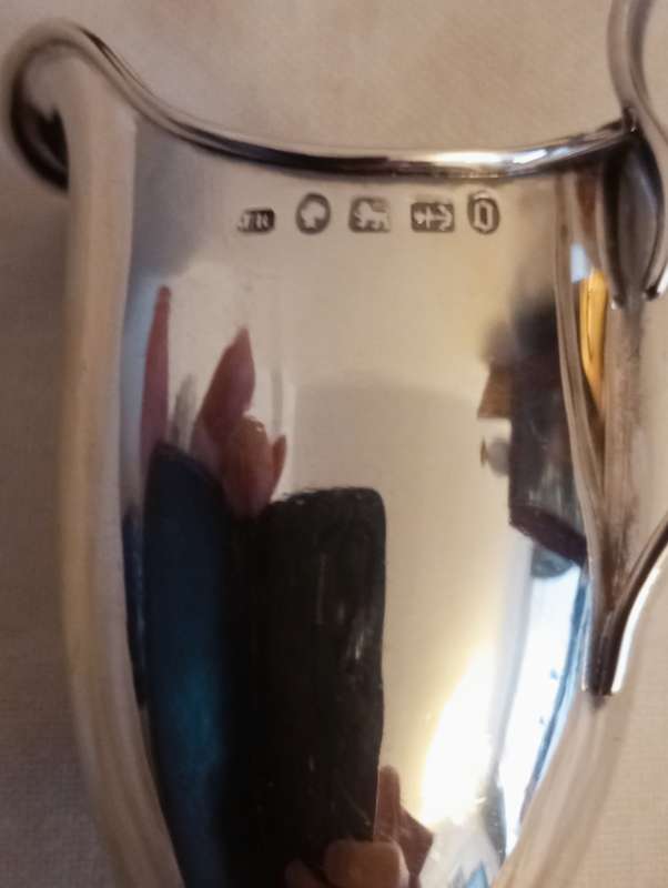 A lovely silver helmet jug in Georgian style
