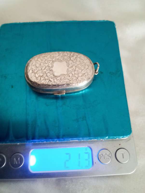 A sterling engraved sovereign case pendant