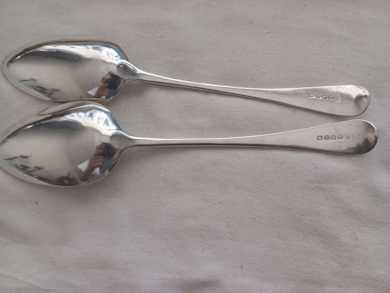 A matching pair of silver Georgian serving spoons