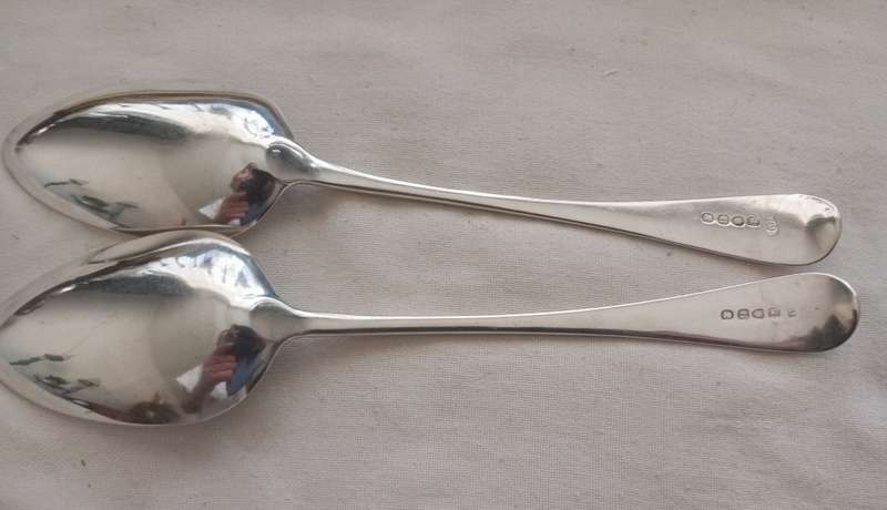 A matching pair of silver Georgian serving spoons