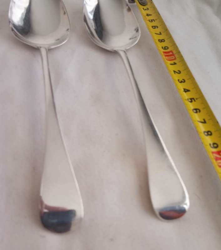 A matching pair of silver Georgian serving spoons