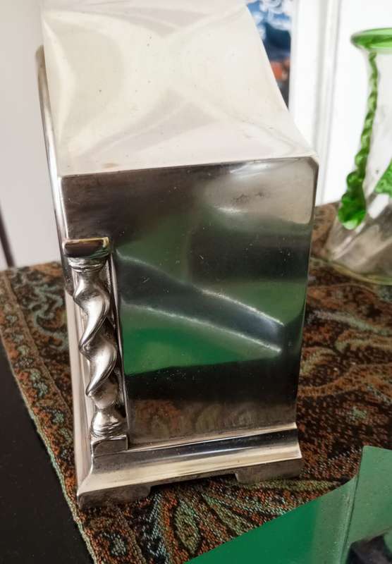 A fine silver plate vintage mantle clock in working order