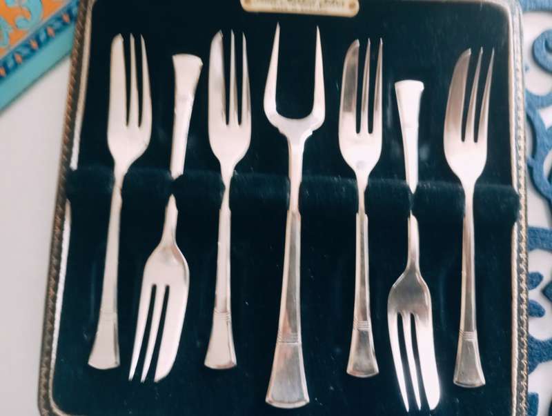 A fine boxed  set of sterling silver  cake forks