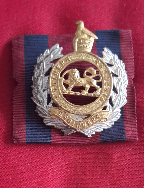 SOUTHERN RHODESIA ENGINEERS - OFFICERS FROSTED GILT CAP BADGE ON RIBBON BACKING - RARE -GAUNT (8903)