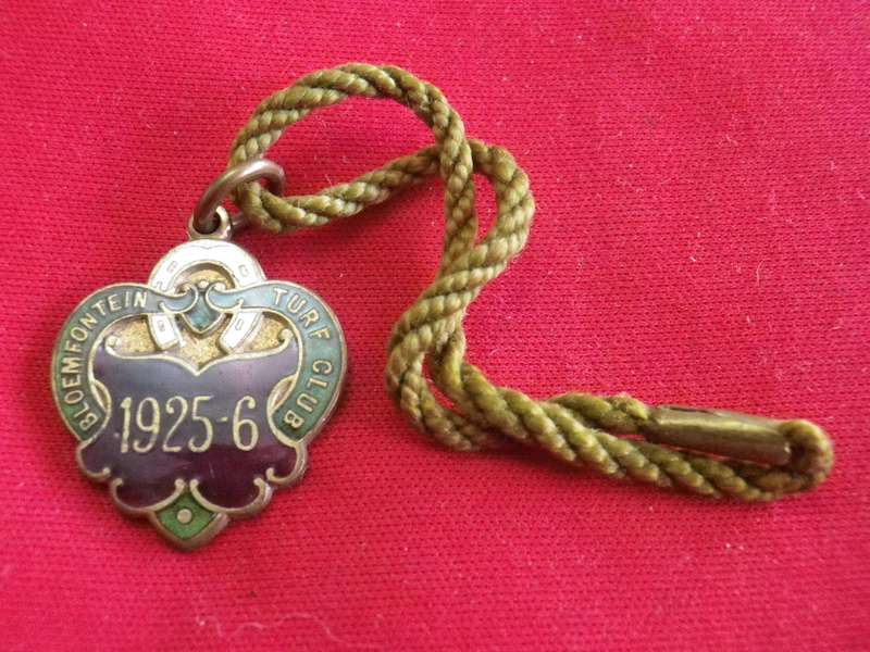 TURF CLUB BADGE - 1925-6 BLOEMFONTEIN TURF CLUB,  SA -  NO 65  - WITH ORIGINAL CORD           (12)