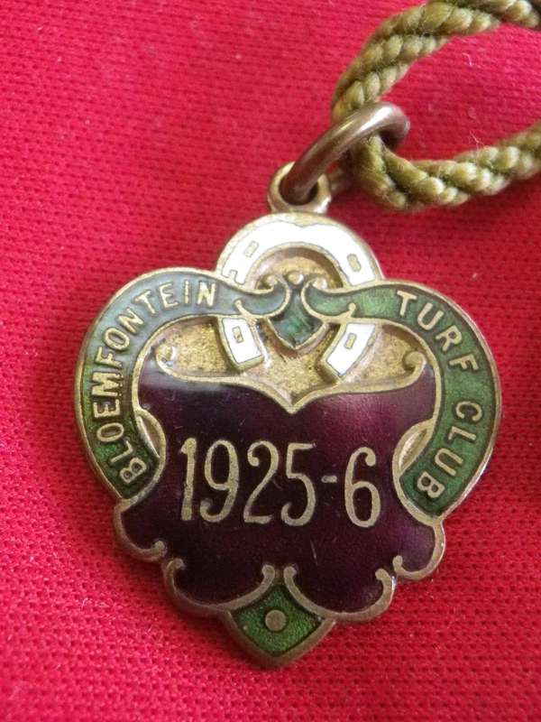 TURF CLUB BADGE - 1925-6 BLOEMFONTEIN TURF CLUB,  SA -  NO 65  - WITH ORIGINAL CORD           (12)