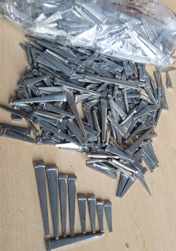 UNUSED...ASSORTED Steel Cut Masonry Nails. (Bid Per 50-Piece Pack)