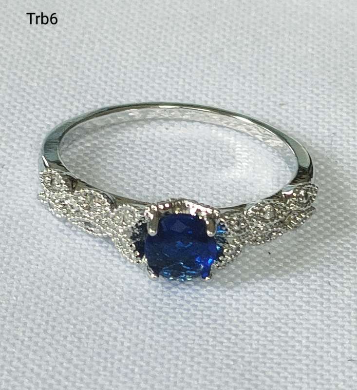 Dress ring -lab created blue and white stones- size US 7