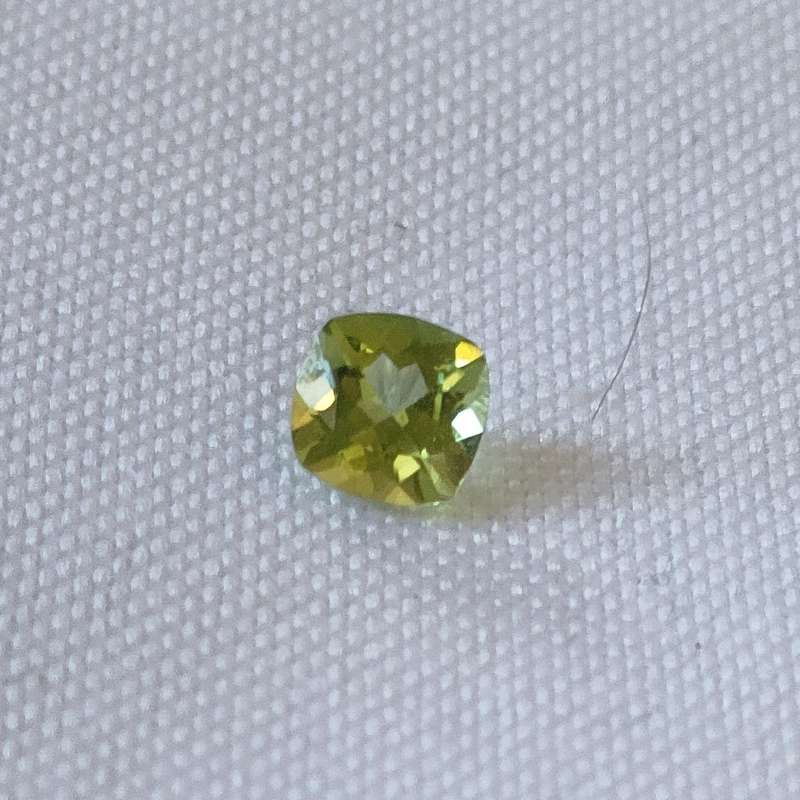 Peridot stone - naturally mined - :0.56 carats - cushion cut: - great colour and clarity
